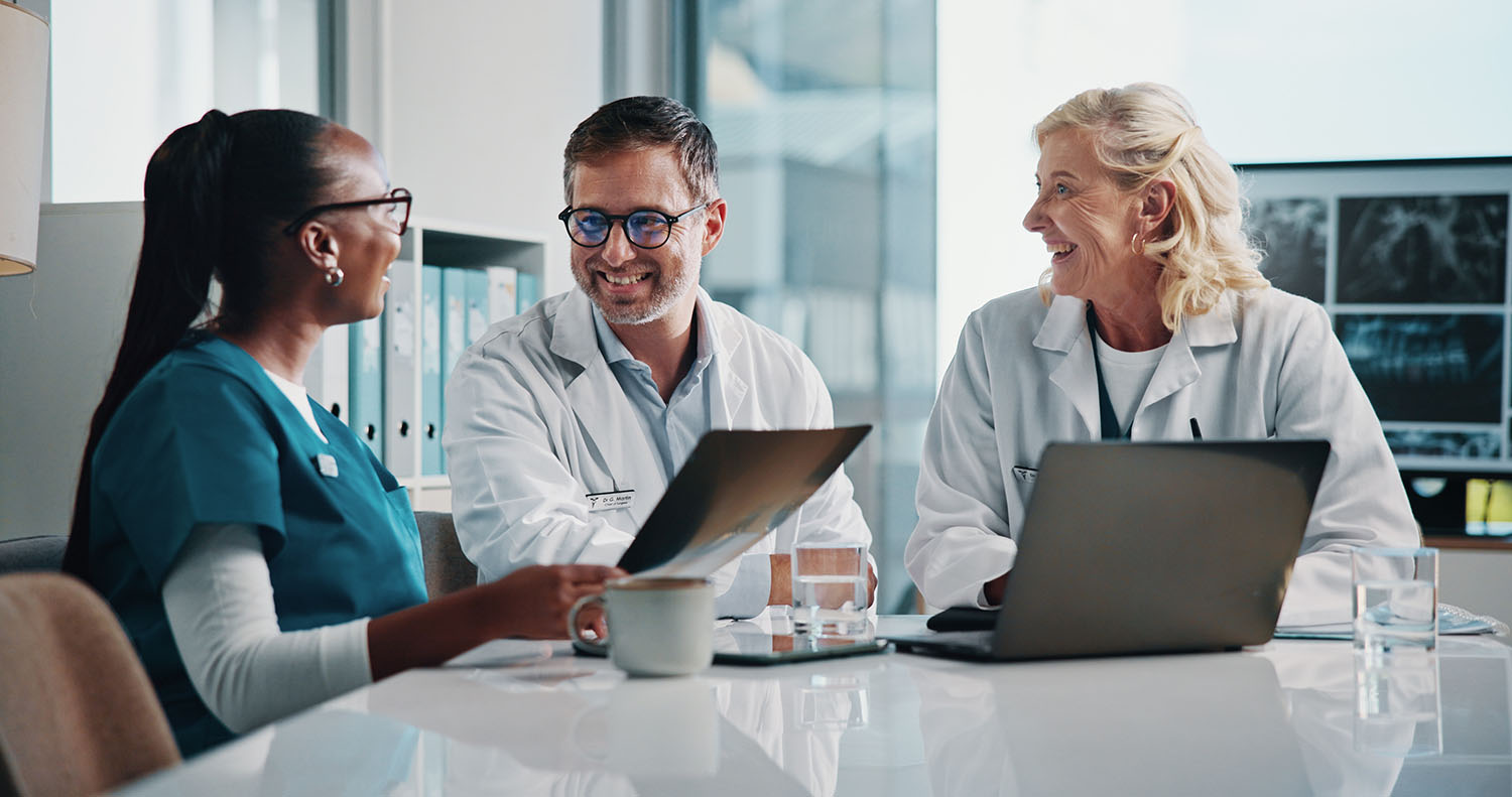 Hospital, x ray and doctors in meeting for teamwork, consulting and medical advice with scan. Healthcare, radiology and man and women on digital tech for collaboration, research and patient diagnosis AdobeStock 1280362710