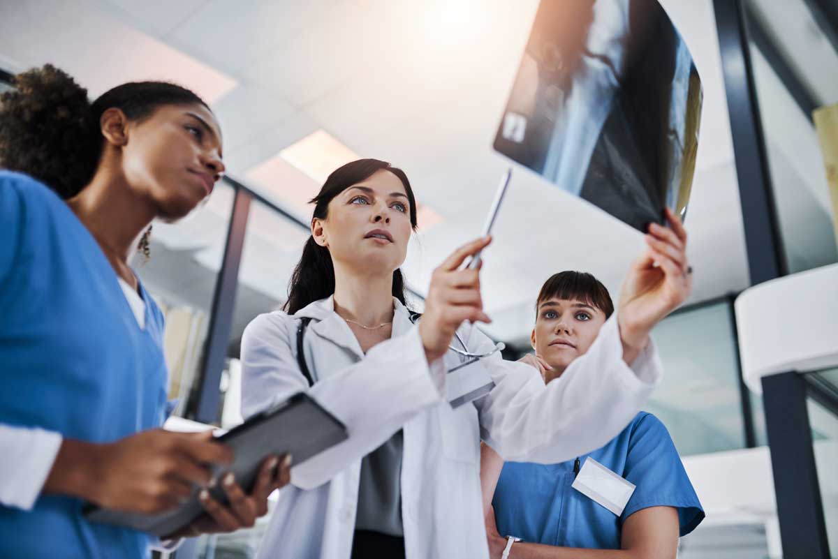 doctors analyze X-ray film doctors analyze X-ray film