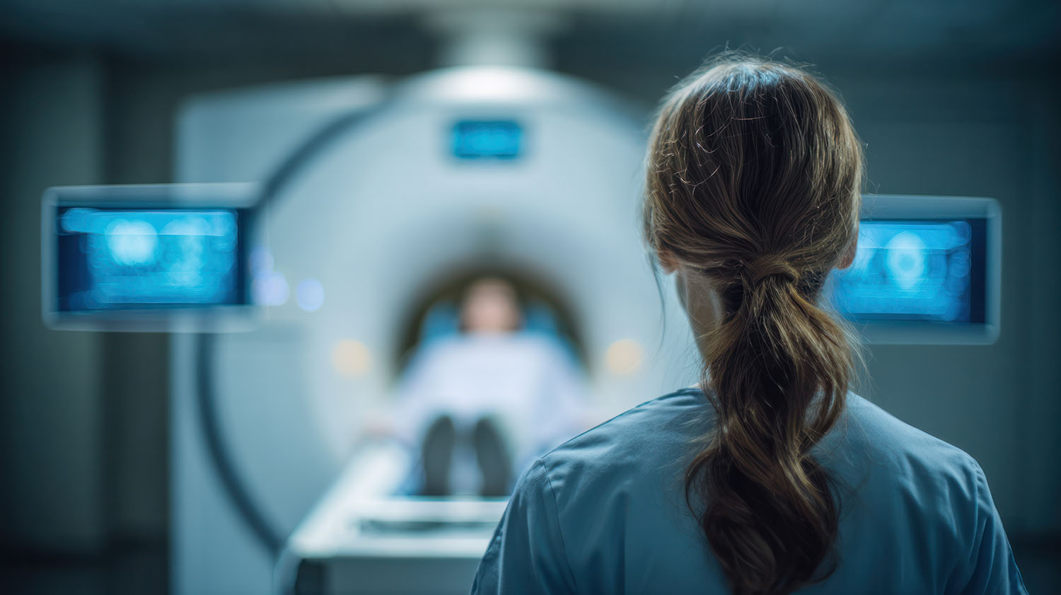 Medical Imaging Scene: A medical professional observes a patient AdobeStock 2036056403